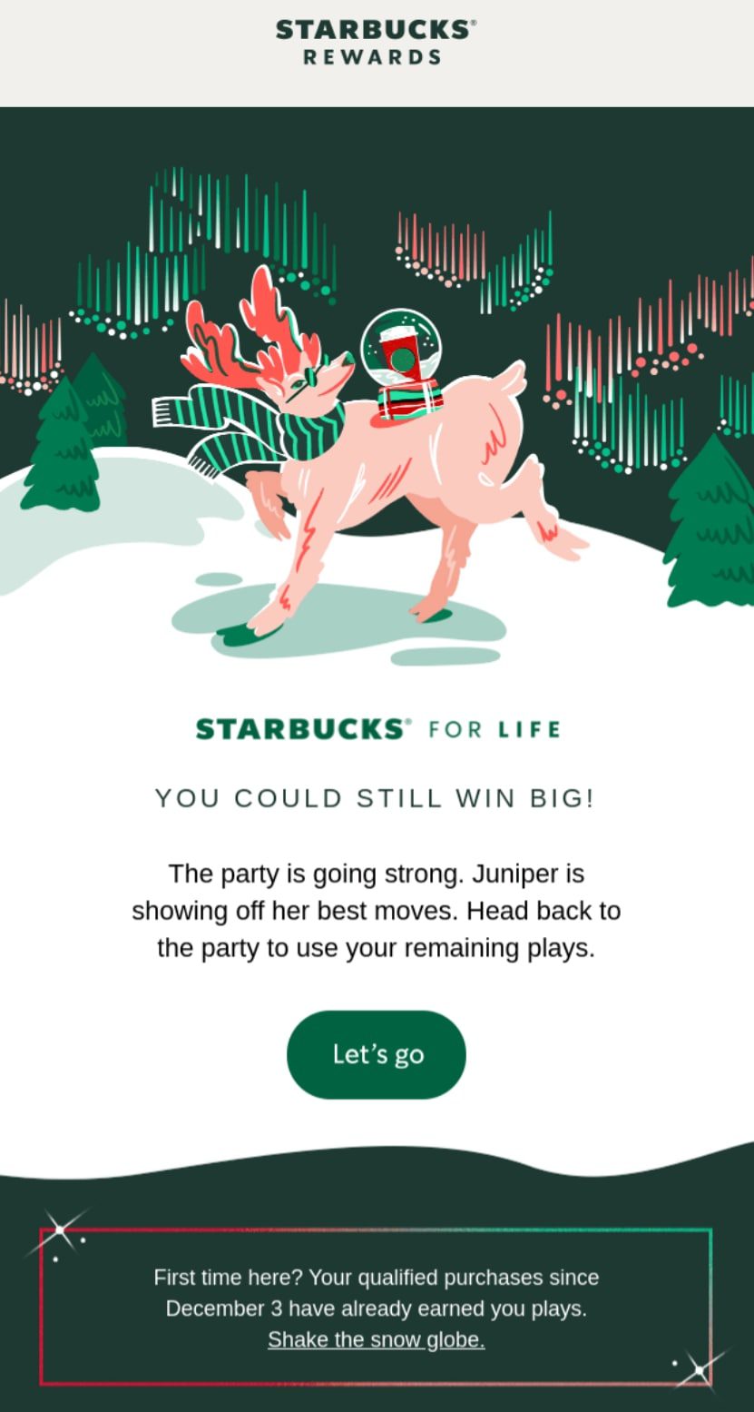 A holiday email campaign by Starbucks with a pink reindeer under northern lights. 